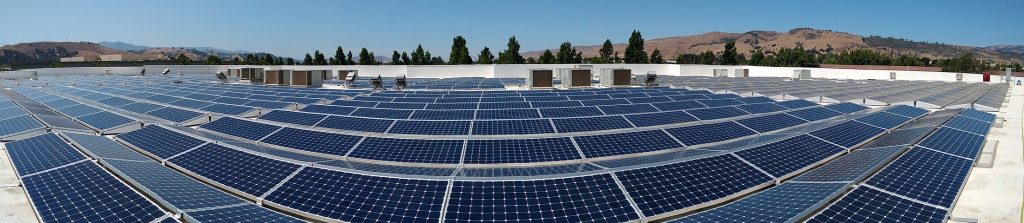 Panoramic view of a huge rooftop solar panel installation
