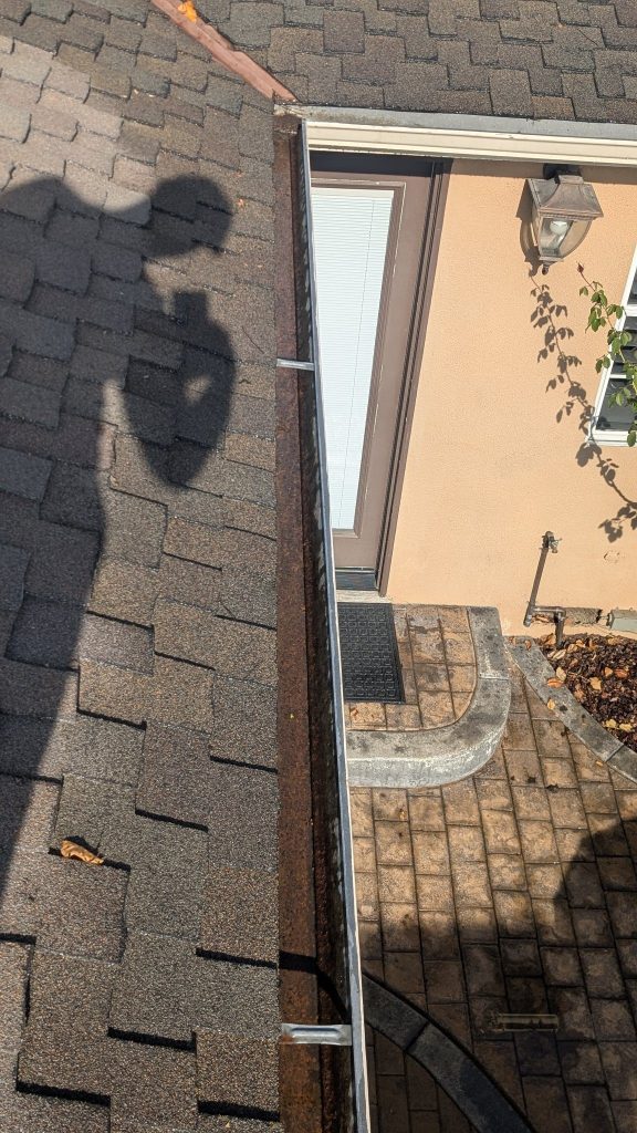 Gutter cleaned out by California Glass and Solar