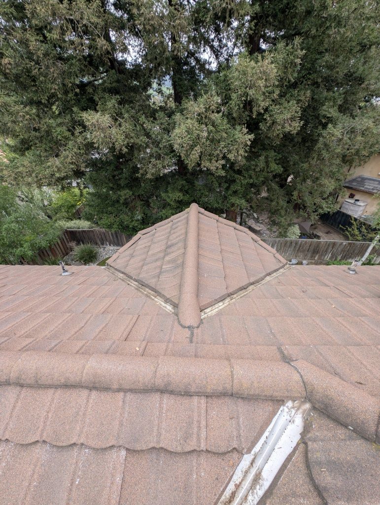 Tile roof valley cleared by California Glass and Solar